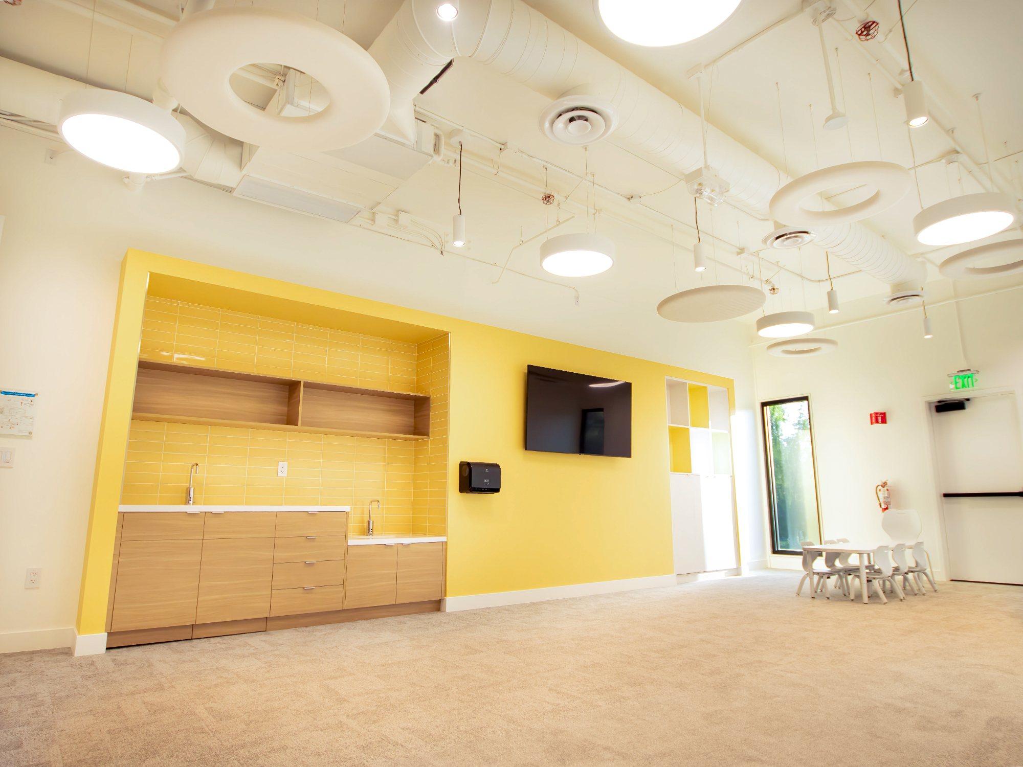 Venture Christian Church Kids Area, classroom with yellow built-ins